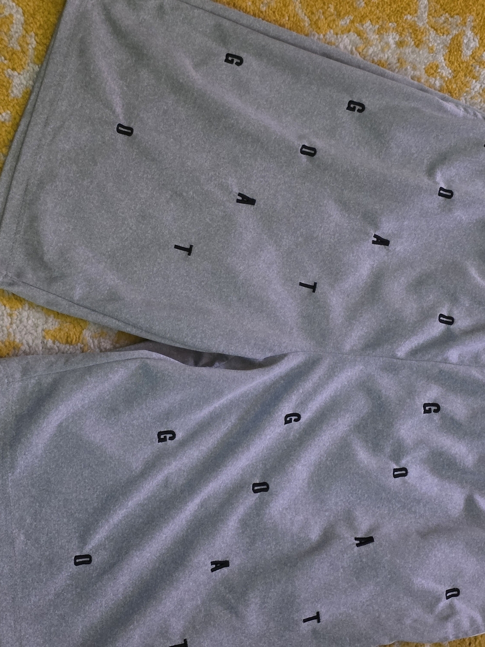 Gray Athletic Shorts with Minimal Black Lettering